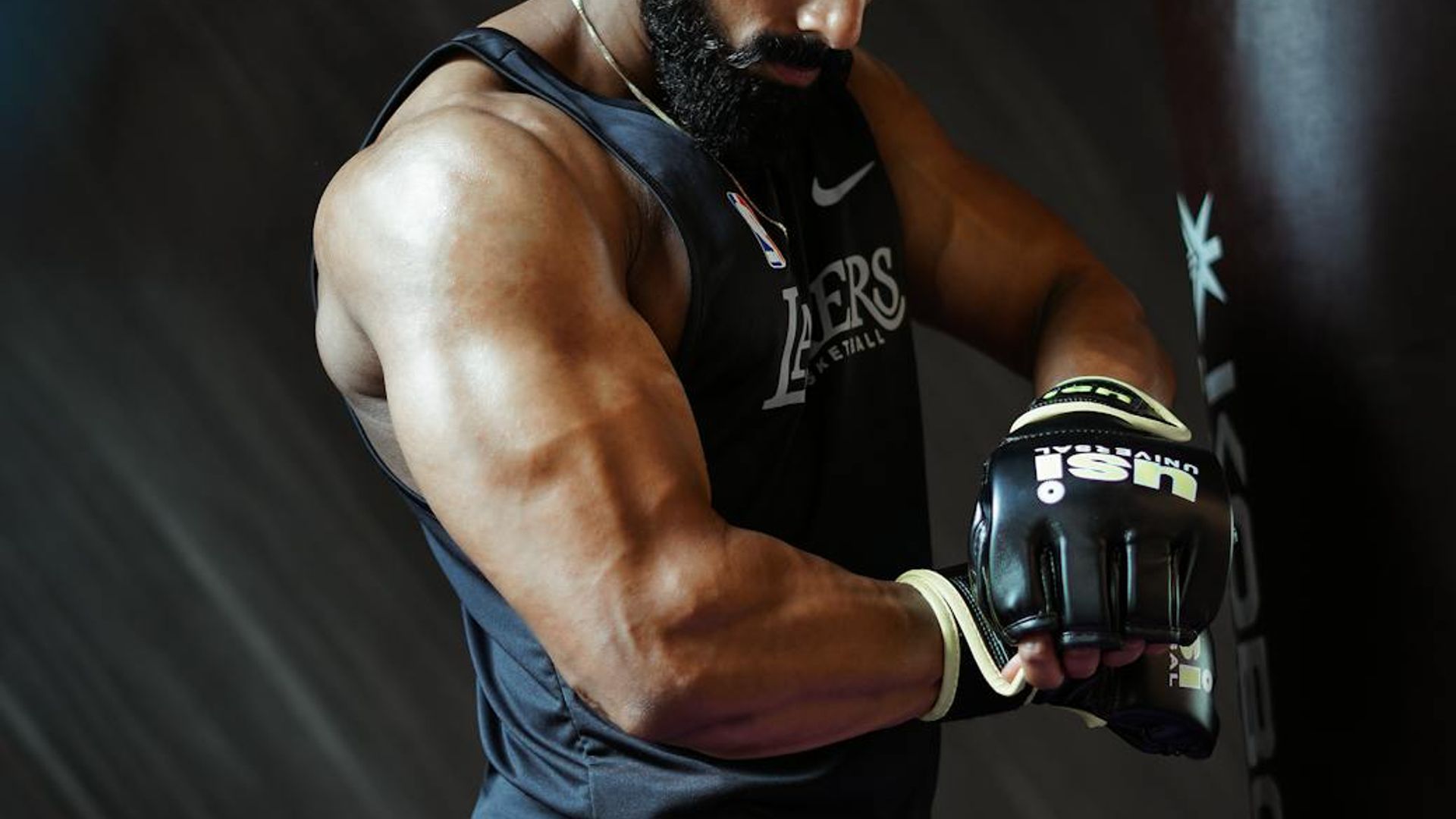 Man in a focused stance preparing for a strength exercise.